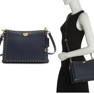 • 11" W x 8" H x 2" D
• 9" handle drop
• Leather exterior,